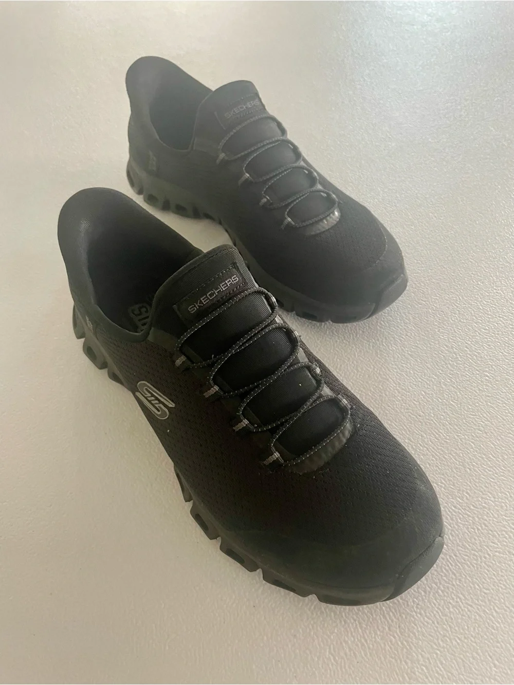 Skechers womens Black Slip-On Sneakers-Pursuit, size 8.5